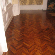 The Teak Herringbone floor with a solid brass inlay.